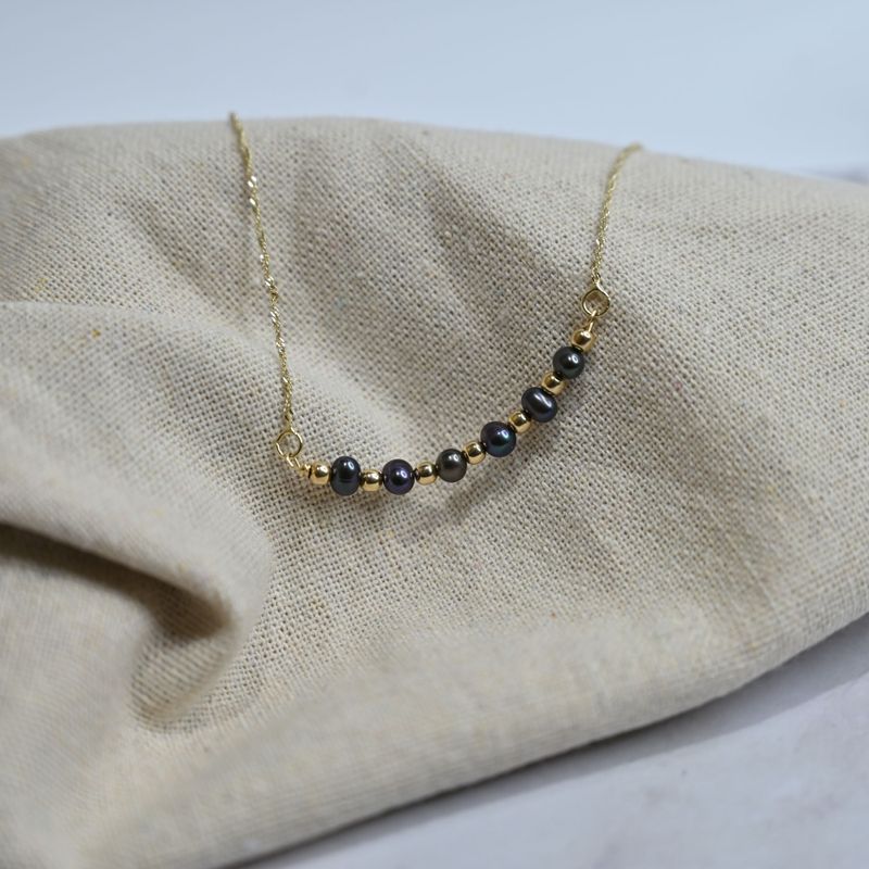 A 14 Carat Gold Chain With Black Pearl Beads Combined With 14 Carat Gold Beads