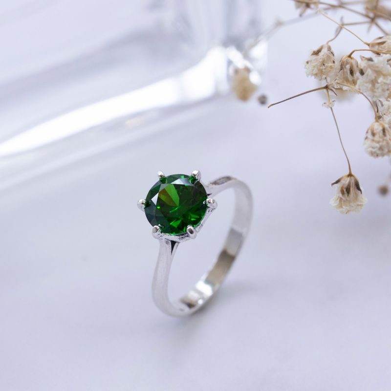 silver closed ring with green cz 8mm facet