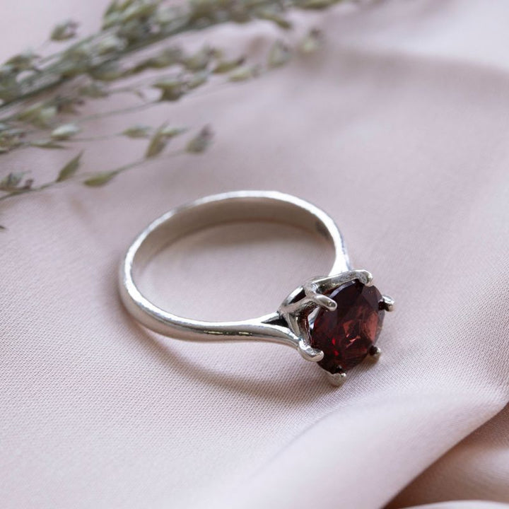 silver closed ring with garnet 8mm facet