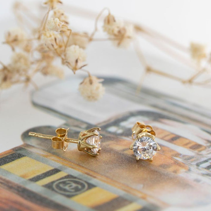 14 -Carat Gold Earrings In a 5 mm White Zircon Inlay