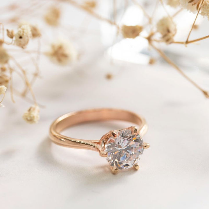 Rose gold ring with white zircon 7 mm facet