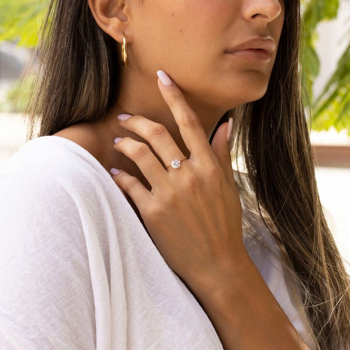 Rose gold ring with white zircon 7 mm facet