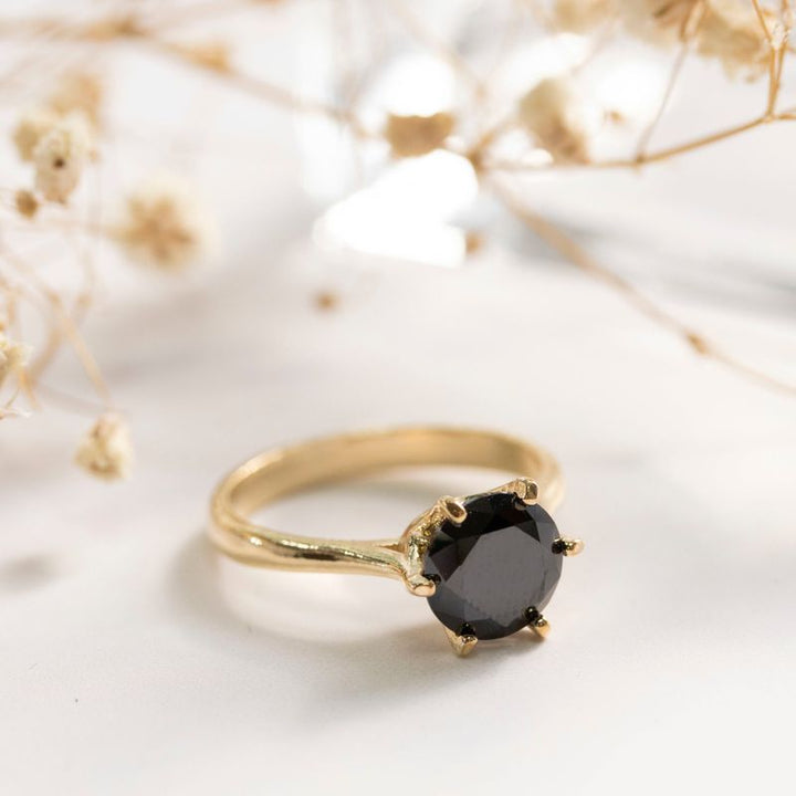 gold plated closed ring with black cz 8mm facet