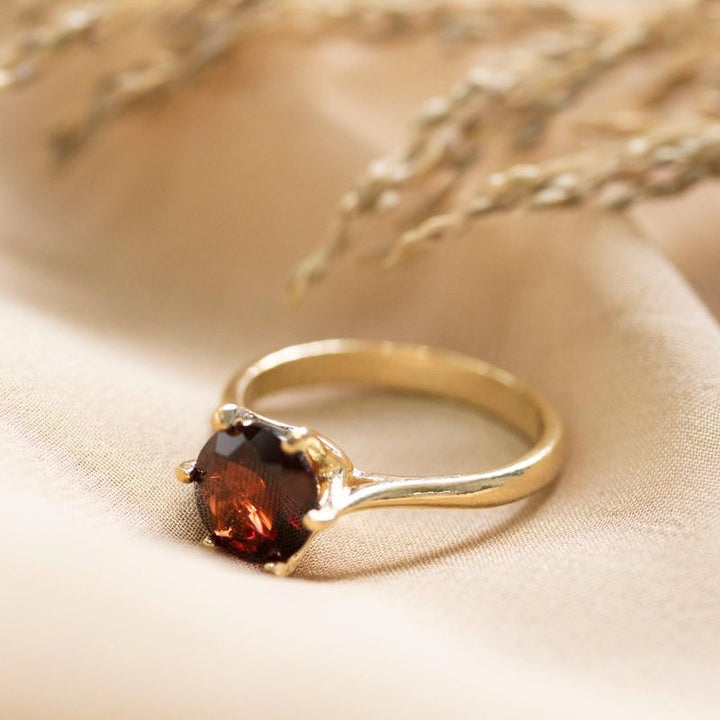 gold plated closed ring with garnet 8mm facet