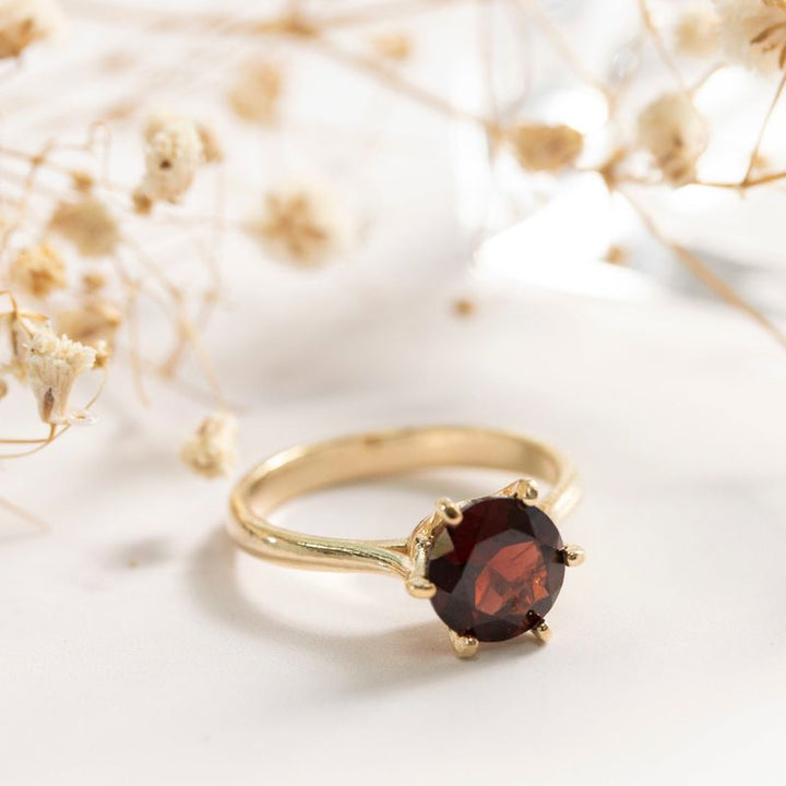 gold plated closed ring with garnet 8mm facet