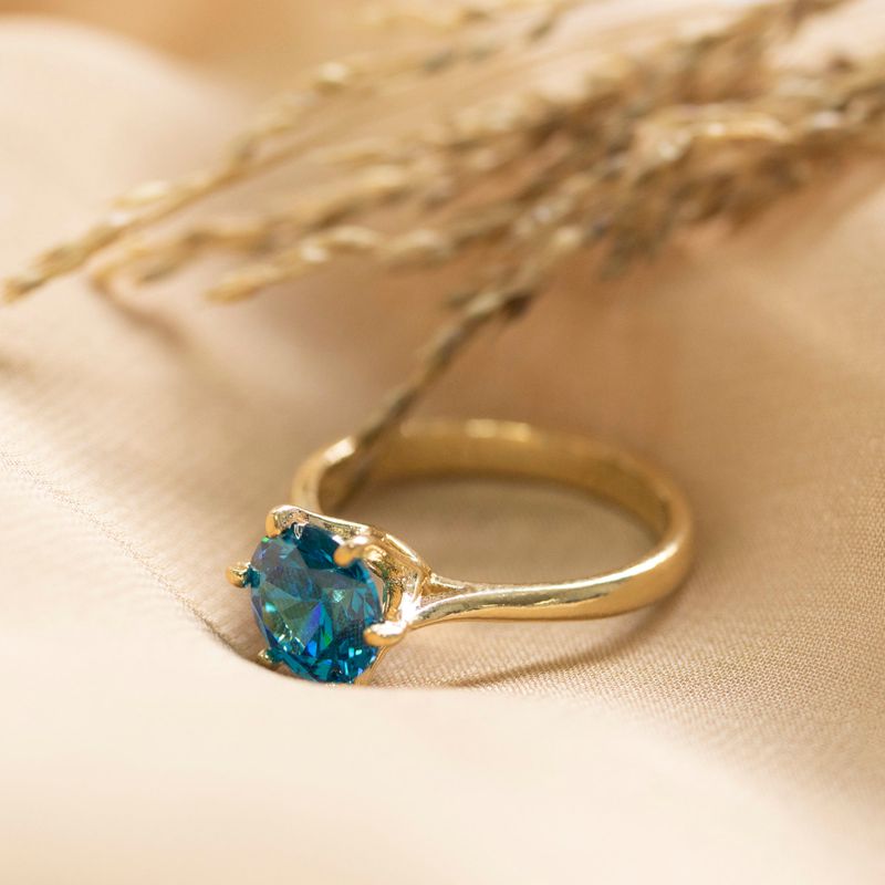 gold plated closed ring with blue cz 8mm facet