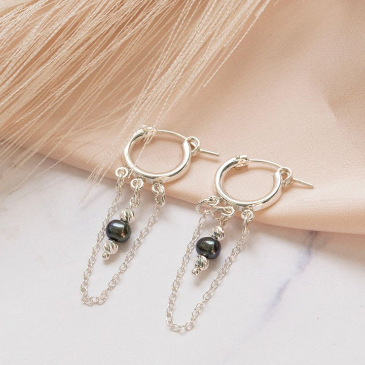 Silver hoop earrings with falling chain and pearl and two silver beads