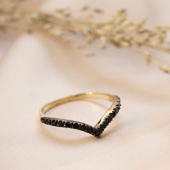 Yellow gold arrow shaped ring inlaid with white zircons