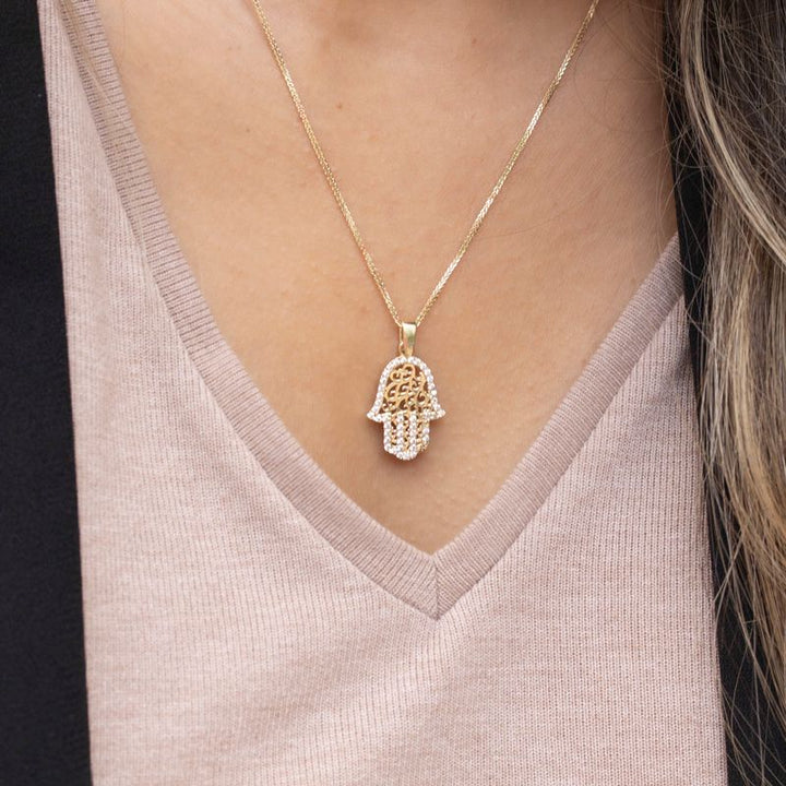 Hamsa pendant yellow gold with decorations and small white zircons