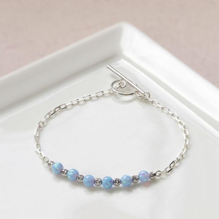 Silver Bracelet with Silver Separator Beads and Blue Opal Beads