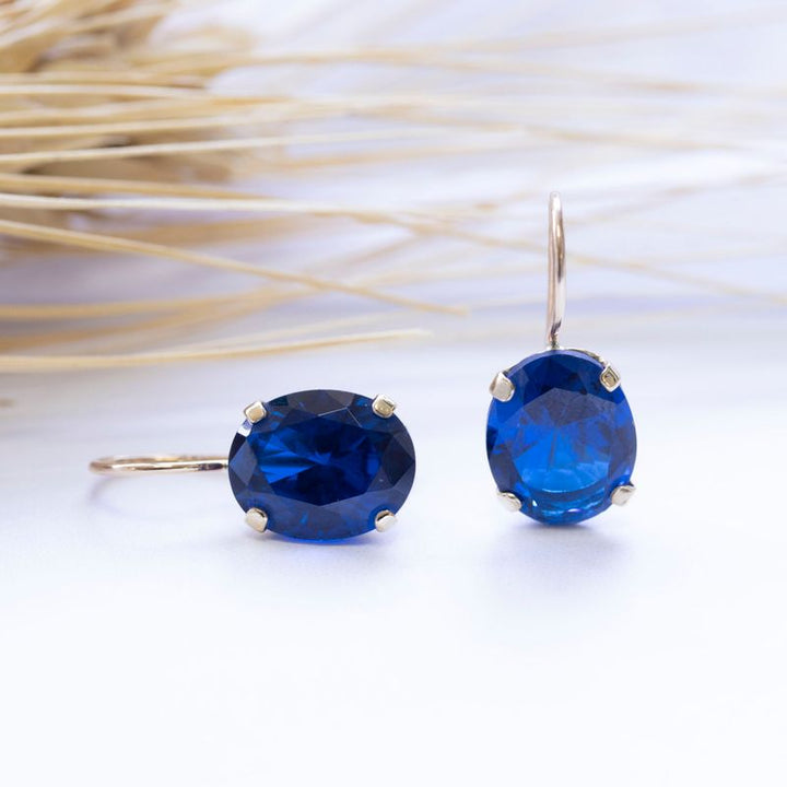 14K Gold Blue CZ 8X10mm Oval Dangle Earrings