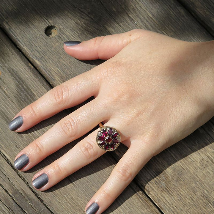 14K Rose Gold Vintage Flower Ring With A 3X5mm Oval Garnet And A 4mm Garnet In The Middle