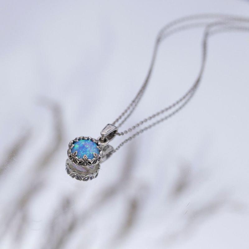 Silver Round Pendant Inlaid with Blue Opal