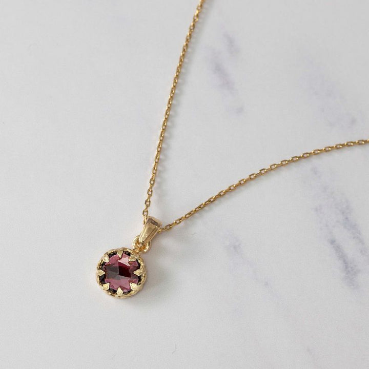 Gold Plated Round Pendant Inlaid with Garnet